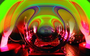 Picture An overlay of the results
of a supercomputer simulation of colliding black holes and a piece of
gravitational-wave detector equipment
