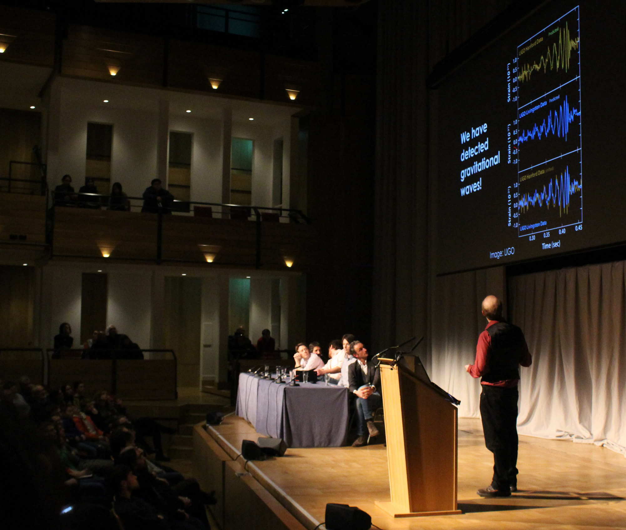 We have detected gravitational waves! Christopher Berry presenting the results in the Elgar Concert Hall, of the Bramall Music Building. Image credit: Hannah Middleton