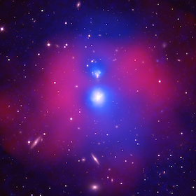 Optical image (yellow/white) of the group-group merger NGC 6338, overlaid with X-ray emission from the groups cores and halos (blue) and with a temperature map tracing the region shock-heated by the collision (red).